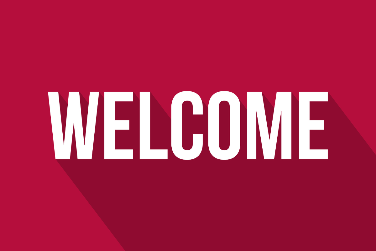 Welcome in bold white capital letters on a red themed shadow background