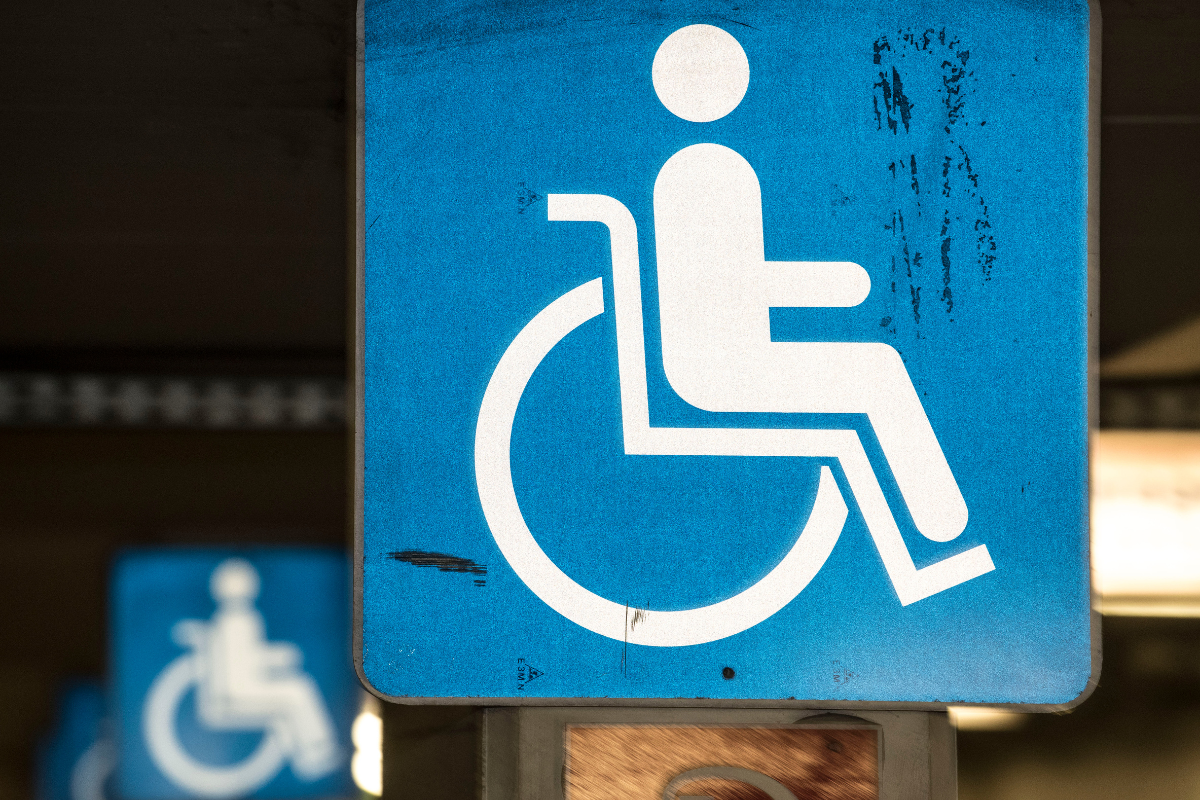 White on blue wheelchair symbol signs