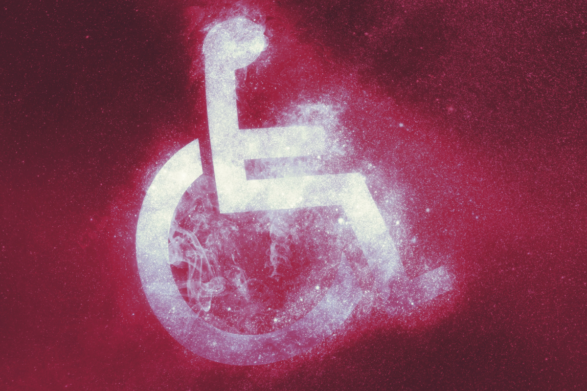 White dissolving wheelchair symbol on a textured red and maroon background