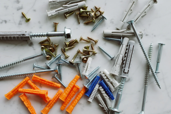 Photo of an assortment of nuts, bolts, screws, and other maintenance supplies